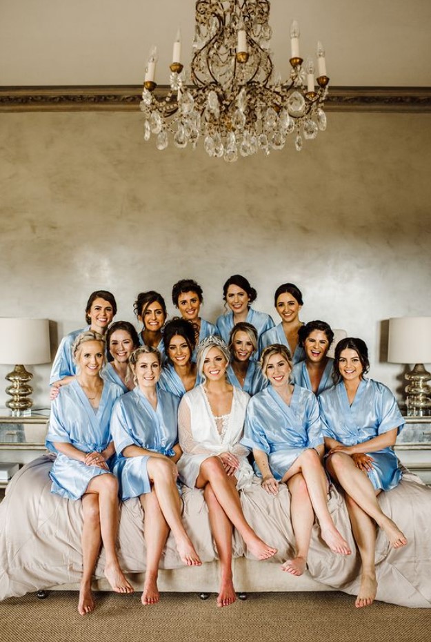 bridesmaids in their baby blue robes
