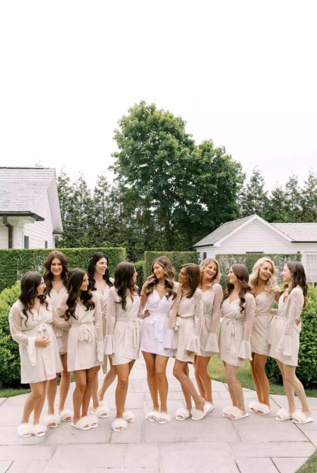 Mira Zwillinger Suri dresse Corey in a white robe and her bridesmaids wearing beige robes and white furry slippers. Image Source: brides.com
