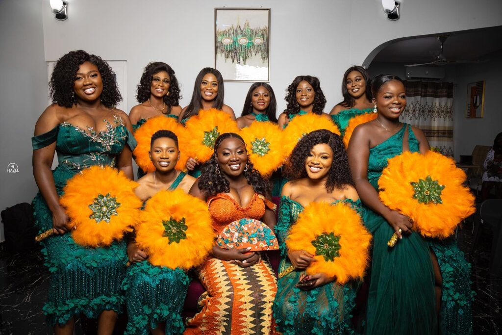 Beautiful bridesmaids at a traditional wedding ceremony pictured with the bride. Image Source: pk-hazel-photography