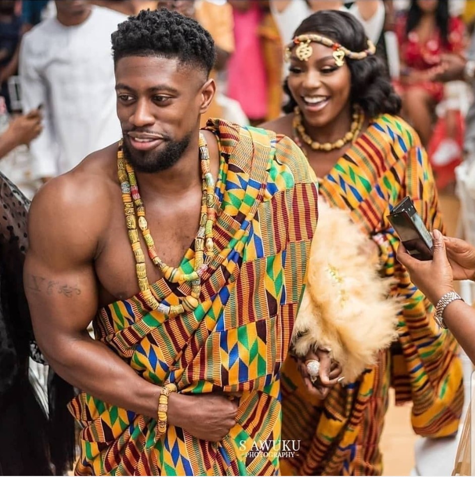 UK-based Ghanaian makeup artist The Queen Hadassah and her husband Daniel on their wedding day. Image Source: @sawukuphotography