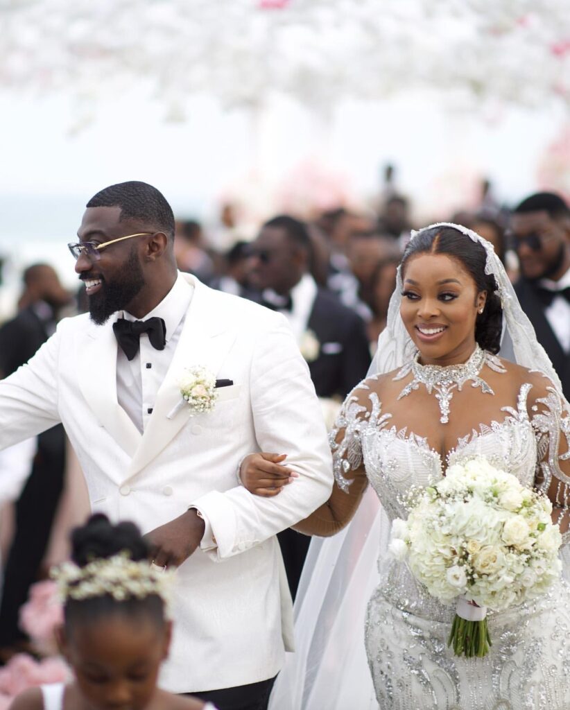 Ghanaian entrepreneur Kojo Jones and his wife, Raychel Osei, at their white wedding at a beach in Ghana. Image Source: Instagram