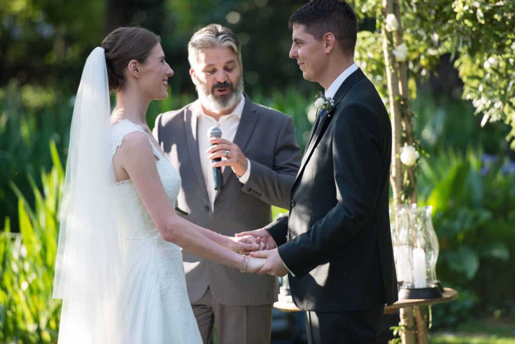 A marriage officer with his client (a couple) on their wedding day. Image Source: marriageofficer.co.za