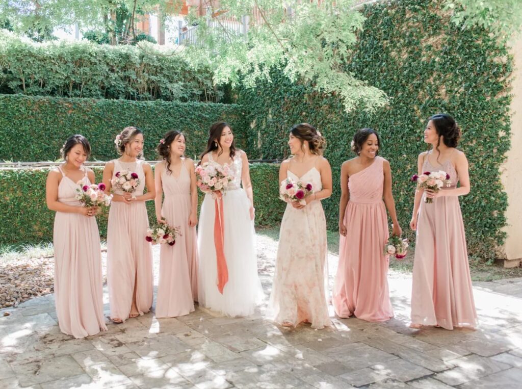 Bride with her bridesmaids in their different stylish color combinations. Image Source: TheKnot