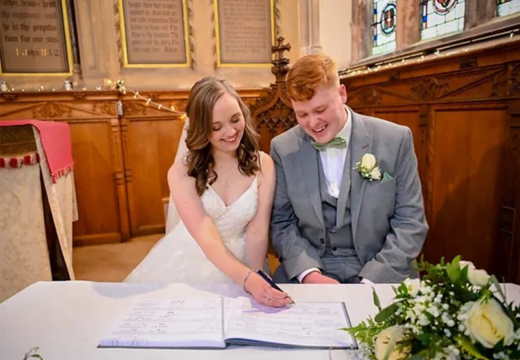 Couple signing their marriage certificate. Image Source: Ian Fry Photography 10