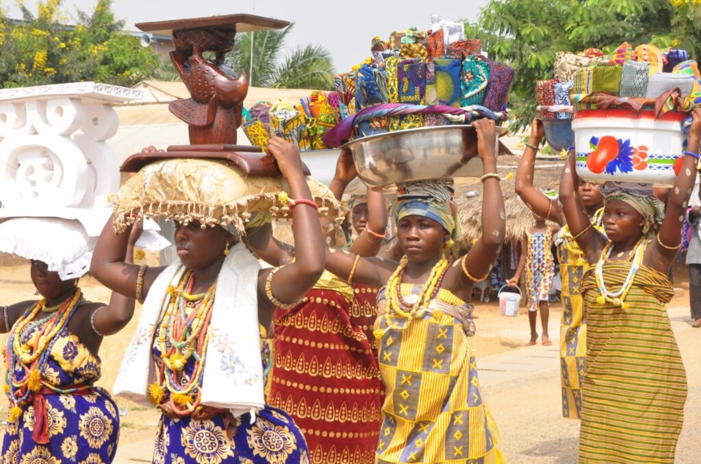 A group of women carrying a wedding dowry. Image Source: battorstate.org