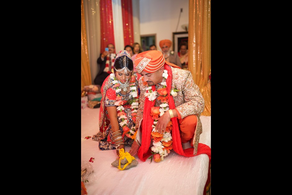 Renita and Ashley, an Indian couple on their wedding day, which took place at the Fairmont Zimbali Resort. Image Source: fairmontmoments weddings