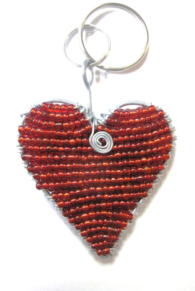 Handcrafted, red heart-beaded keychain made by the Zulu tribe in southern Africa.
A lovely, unique, and everlasting gift idea. Image Source: Nontando