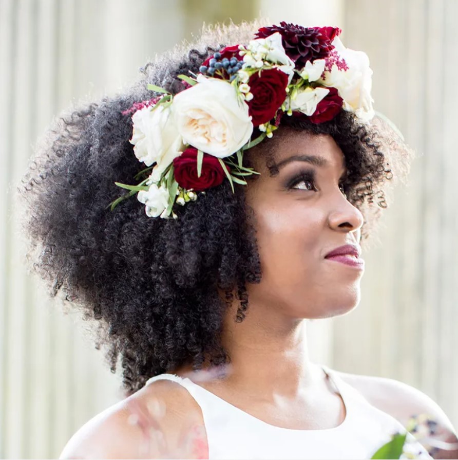 Bride hairstyles - Natural Curls with Flower Headpiece. Image Source: Shane and Lauren Photography