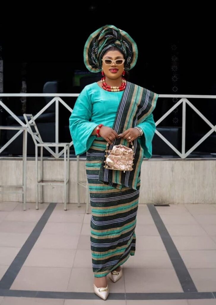 Alaga Toh Porsche is a multilingual, international, eloquent, and stylish event and wedding MC. She is fluent in Yoruba, English, Pidgin, French, Portuguese, and German. She is best suited for Alaga ijoko/iduro roles. Image Source: Instagram/@alaga_toh_porsche