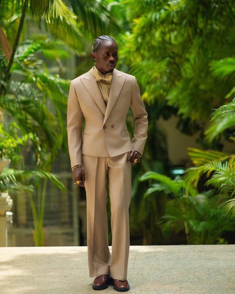 Taiwo Adebiyi is the CEO and lead stylist of Taiwo's Touch, and his company specializes in the art of styling the Nigerian headgear known as gele. Image Source: Instagram/@officialtaiwo_