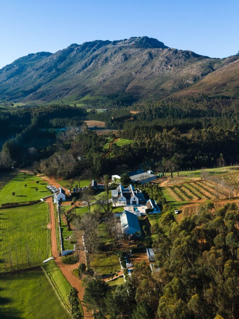 Doolhof Wine Estate is a perfect location for couples looking for a destination wedding where guests can stay on-site and fully unplug in a mountain and vineyard setting. Image Source: Facebook/@doolhofwines