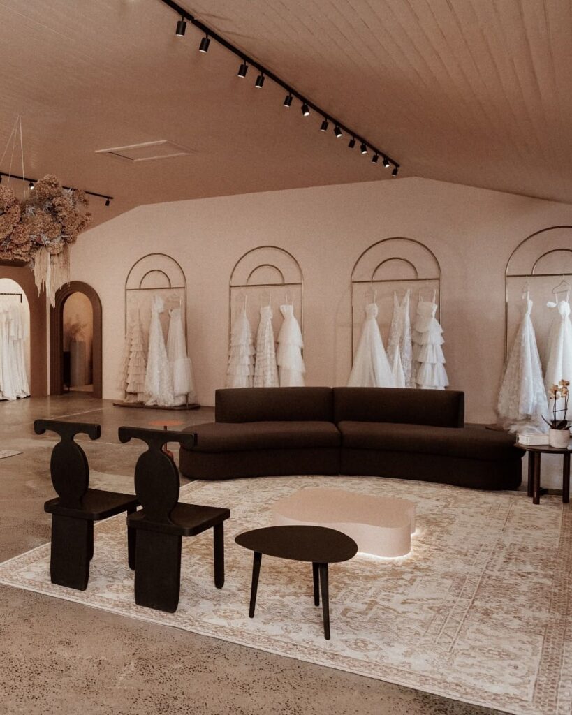 The showroom of the Vagabond Flagship Boutique in Cape Town. This brand shop makes modern ready-to-wear bridal gowns—customizable and made to measure. Ethically designed wedding dresses individually handmade in Europe. Image Source: Instagram/@vagabondflagshipboutique