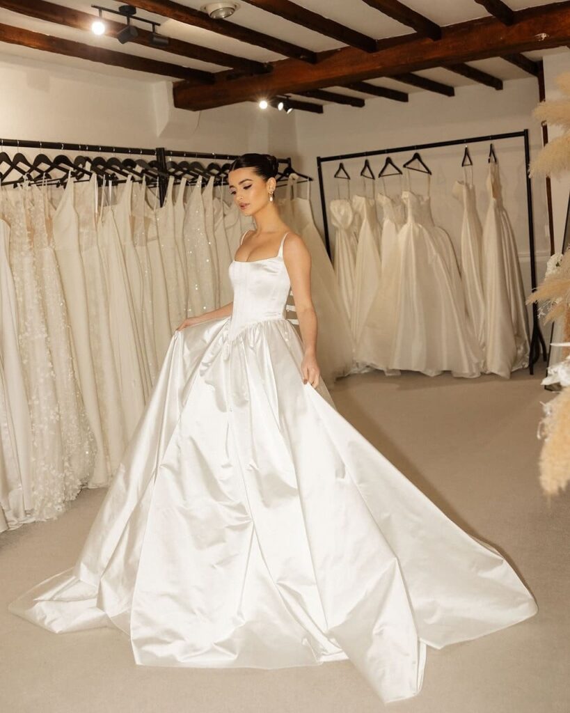 A bride/muse in her beautiful gown from Wedding Boutique SA, a bridal brand that offers luxury wedding dresses in Cape Town and Johannesburg, with international designers and personalized styling. Image Source: Instagram/@weddingboutiquesa